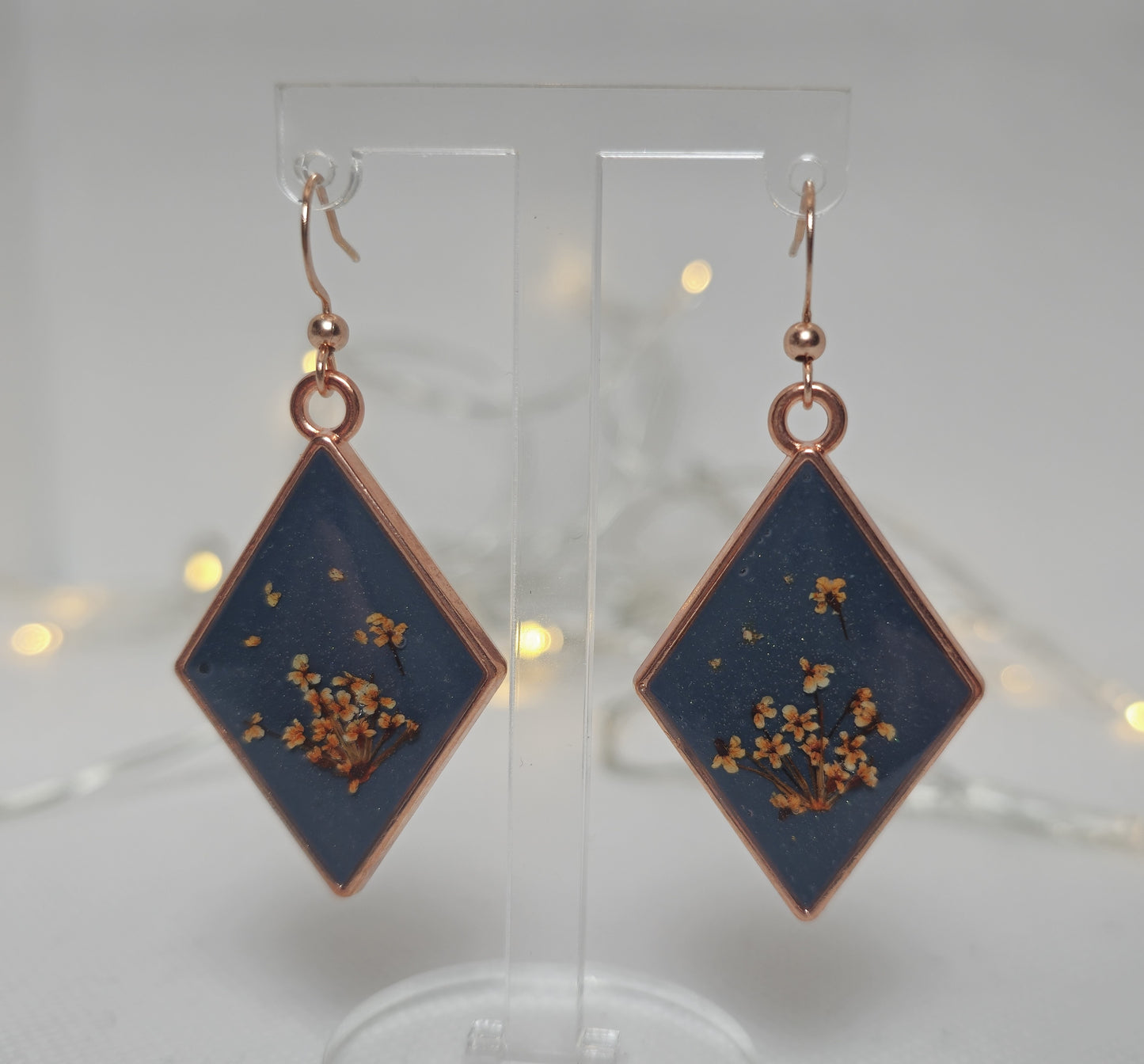 Earrings - Acrylic resin. Navy blue with white /yellow flowers in rose gold