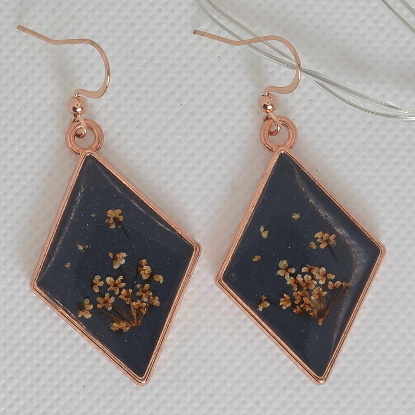 Earrings - Acrylic resin. Navy blue with white /yellow flowers in rose gold