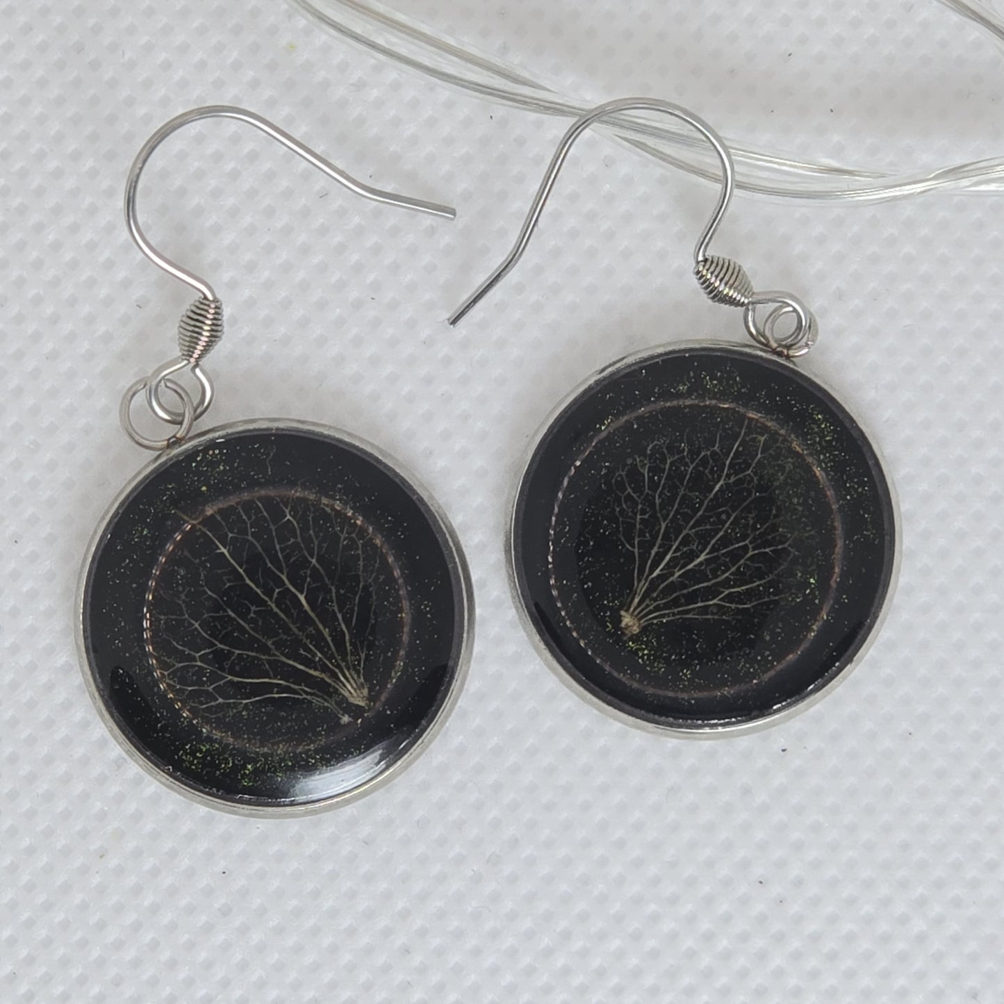 Earrings - Acrylic resin deep black resin base with a delicate hydrangea petal skeleton