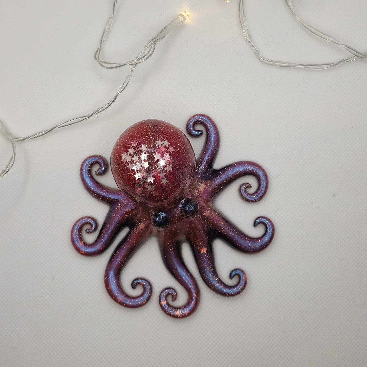 Octopus ornament- pink and purple colour-shifting pigments and star-shaped glitter