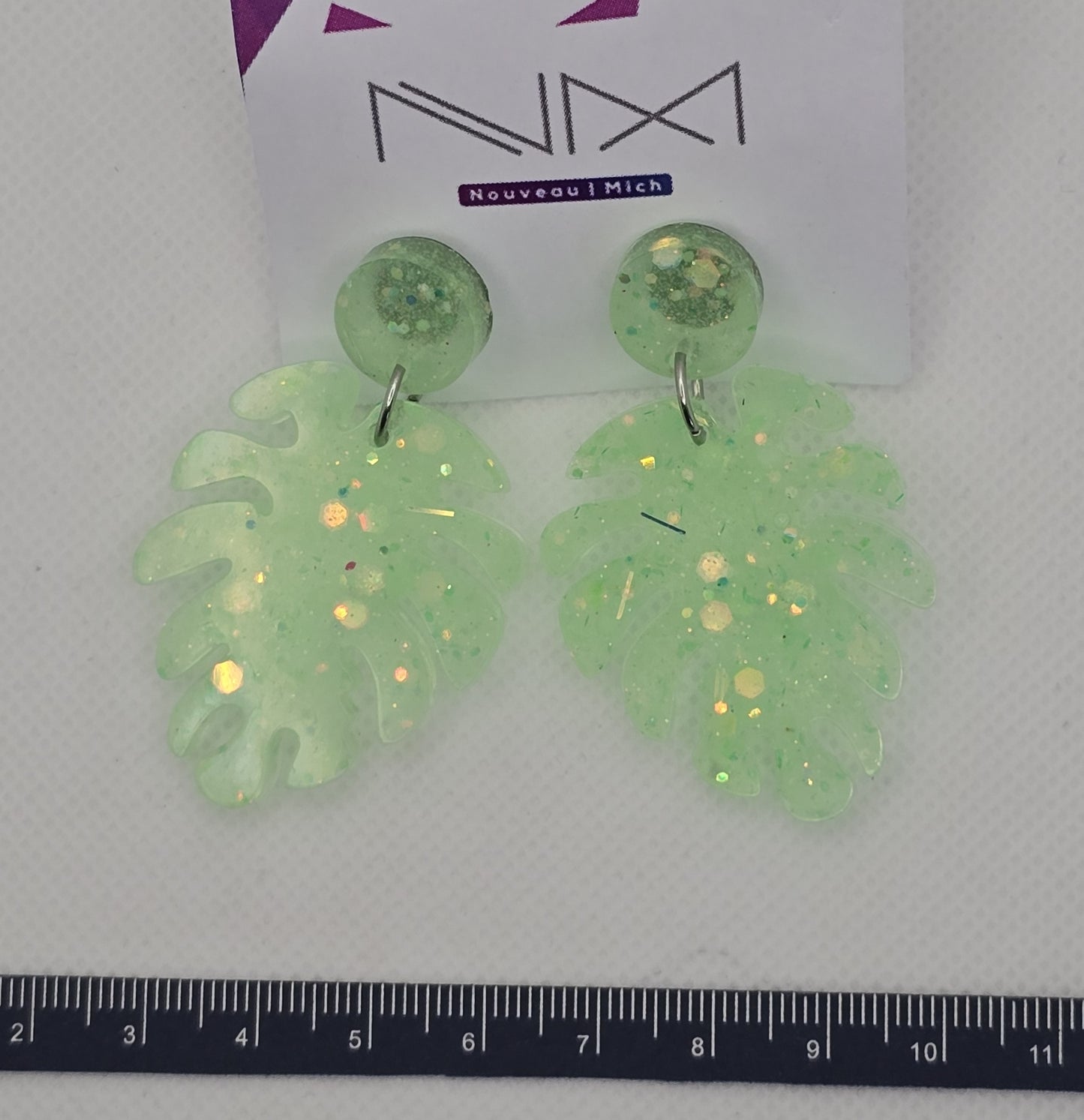 Earrings - Acrylic resin, monstera leaf shaped light green translucent drops with glitter accents