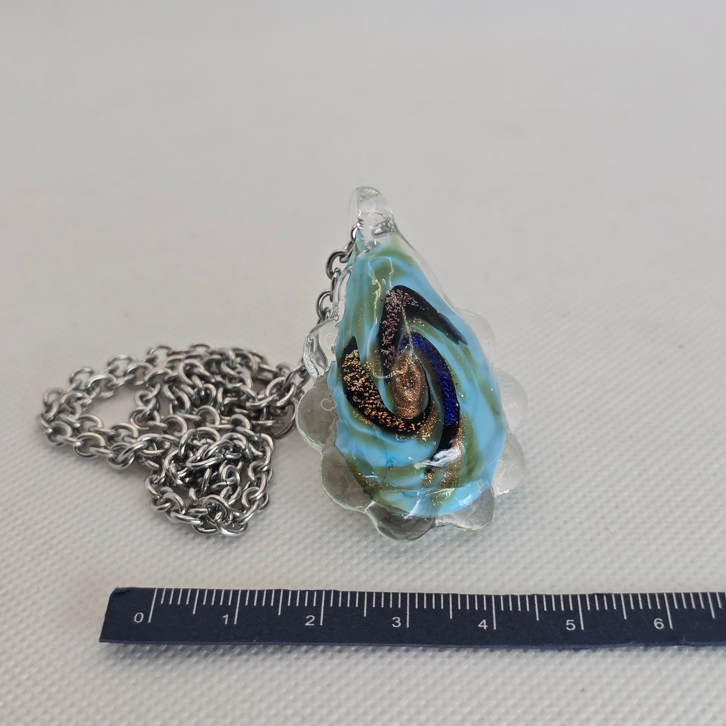Dichroic glass pendant, oval irregular shape