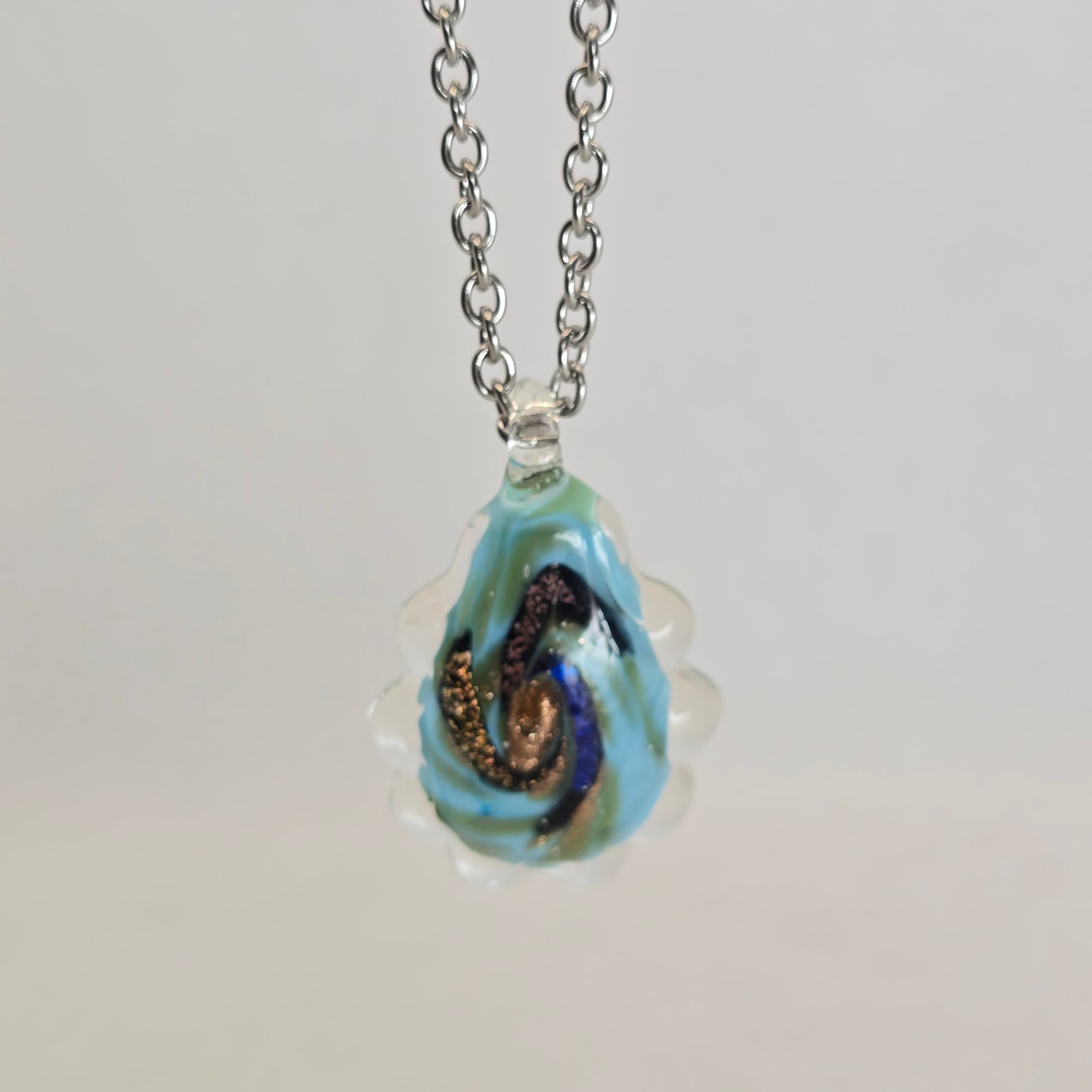 Dichroic glass pendant, oval irregular shape