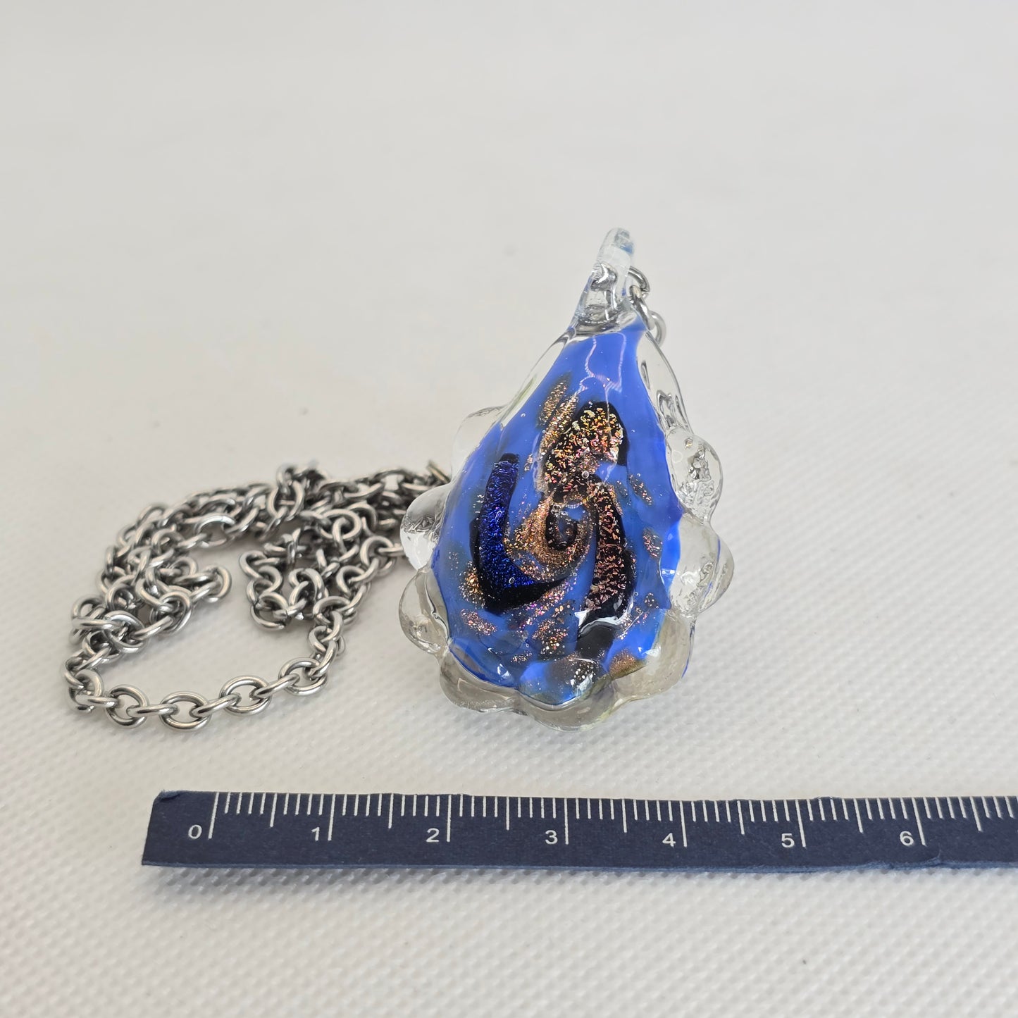 Dichroic glass pendant, irregular oval-shaped