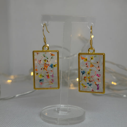 Earrings - Acrylic resin, tiny multi colour flowers encased in clear resin framed in a rectangular gold frame