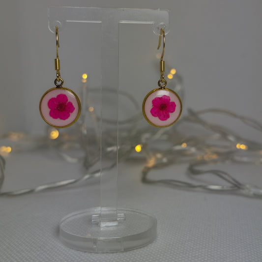 Earrings, Single cerise pink Alyssum flowers resting on beds of pale pink acrylic resin, contained in a dainty round gold-coloured bezel.