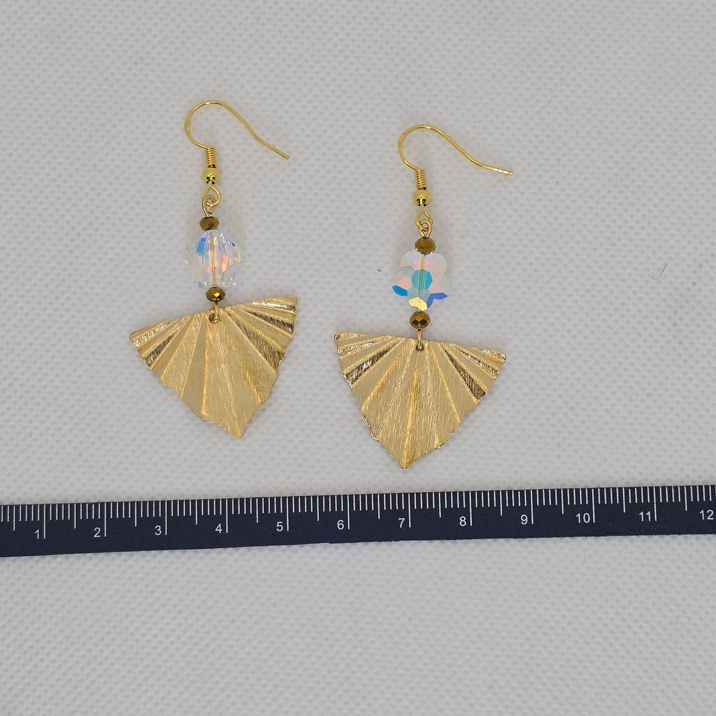 Earrings- Brass fan-shaped dangle enhanced with crystal flower shaped bead