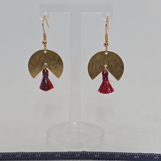 Earring- pie-shaped brushed brass earring with a delicate red and gold tassel dangle